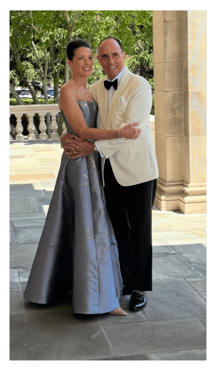 Client in a periwinkle ball gown at a black tie event