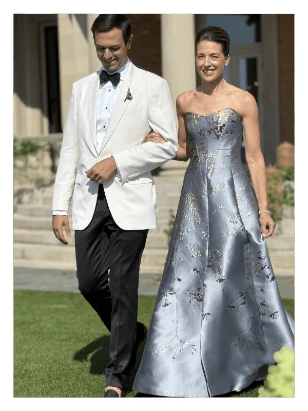 Client in a silver embroidered gown at an estate wedding